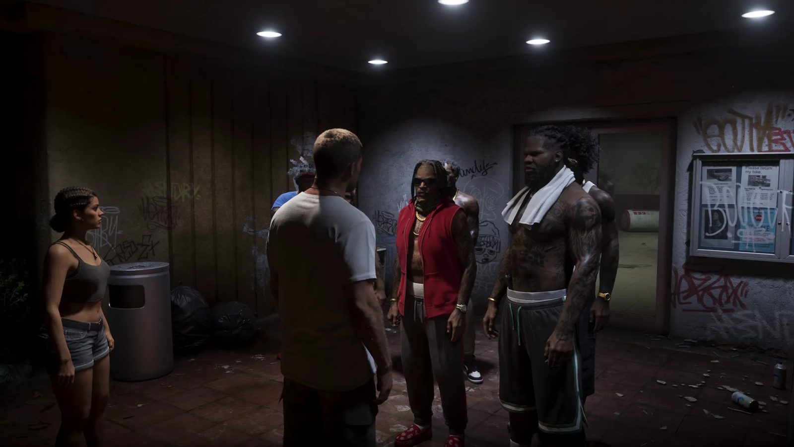 A woman and a man in a white t-shirt face a group of tattooed men in a dim, graffiti-covered covered passage at night.