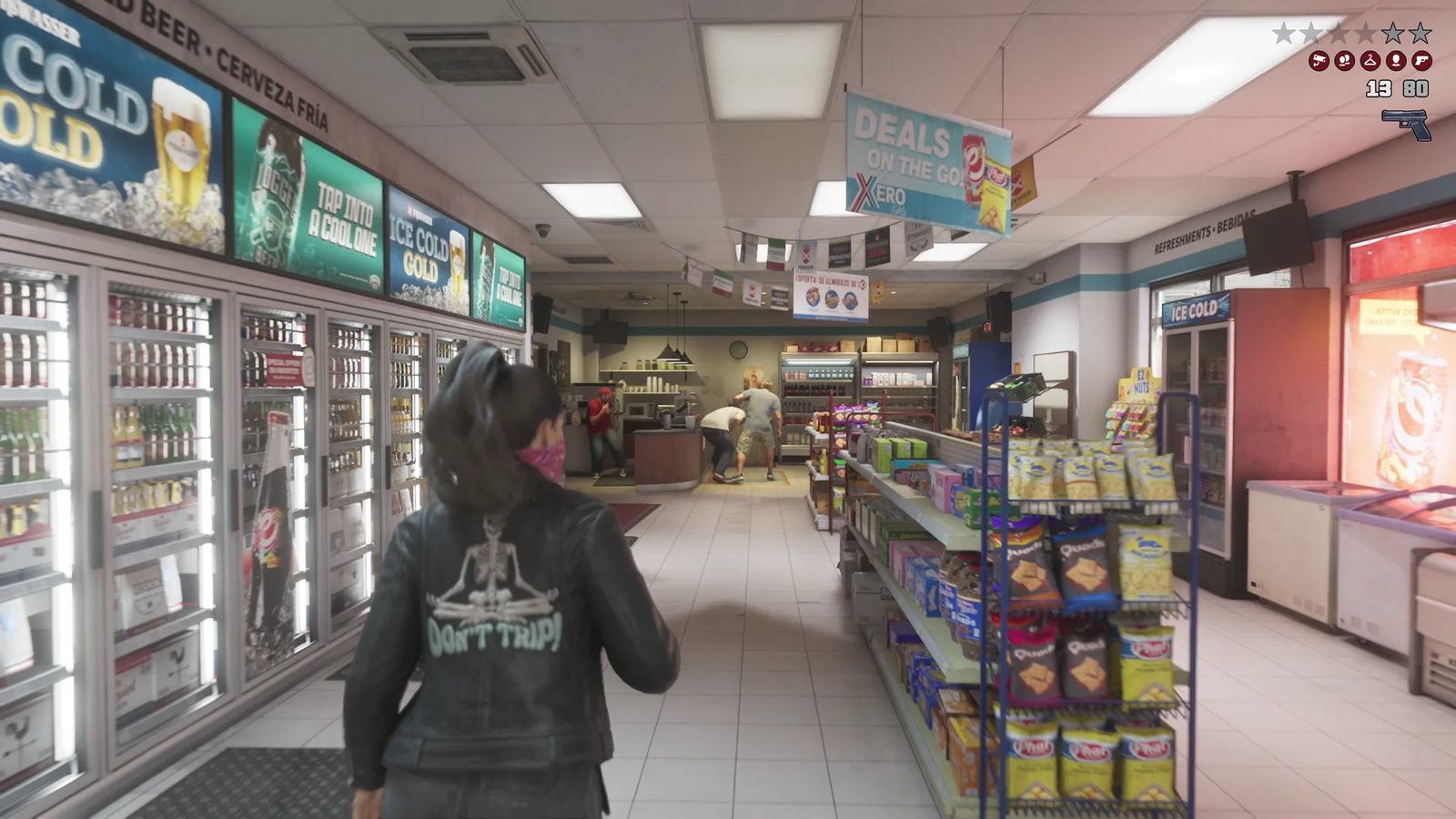 Lucia Caminos, wearing a black jacket and a pink bandana over her face, walks down a convenience store aisle past drinks fridges and snack shelves.
