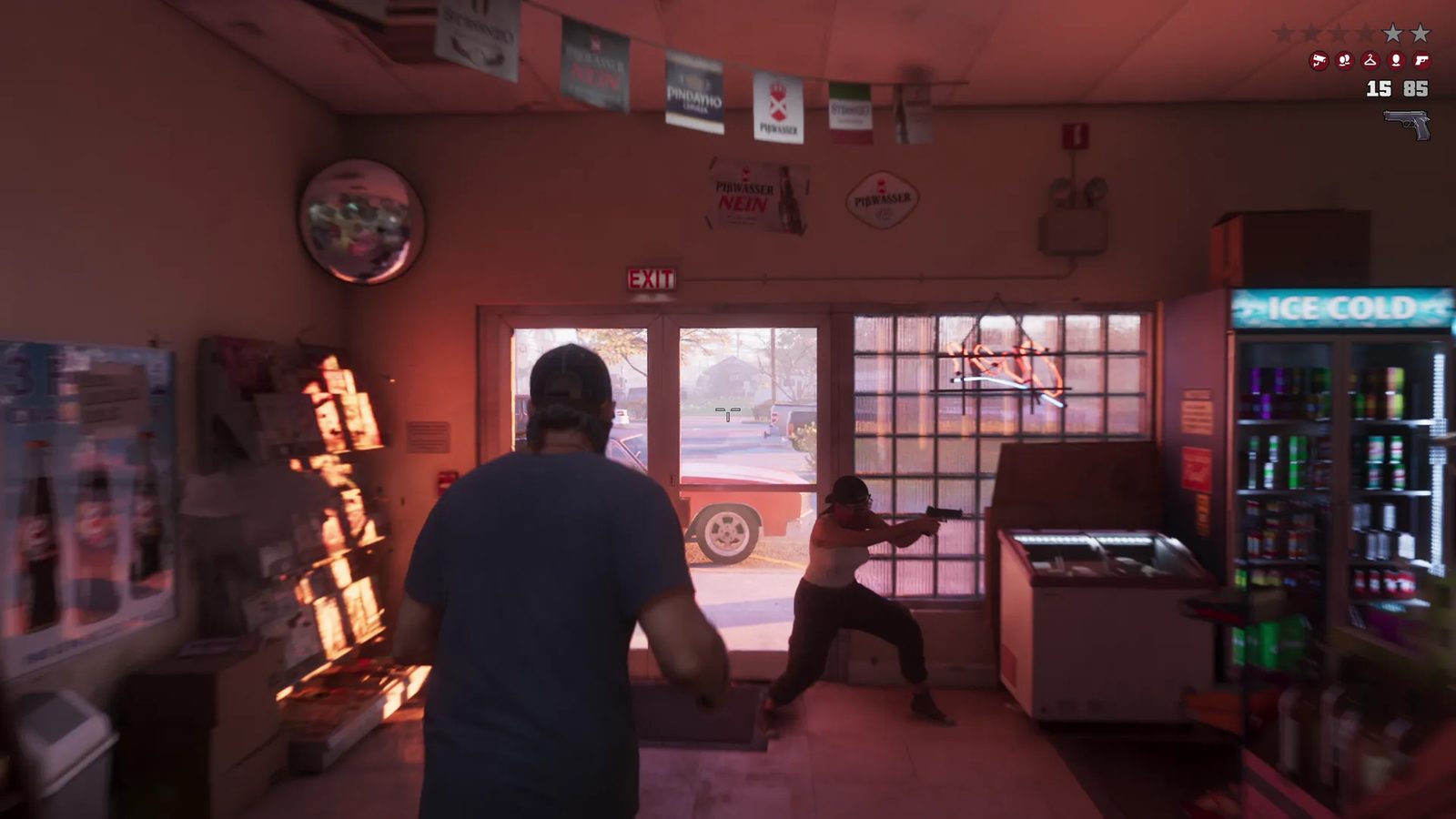 Jason Duval stands in a corner shop as a woman in a cap aims a pistol near the door, with a red car outside and a red-tinted glow inside.