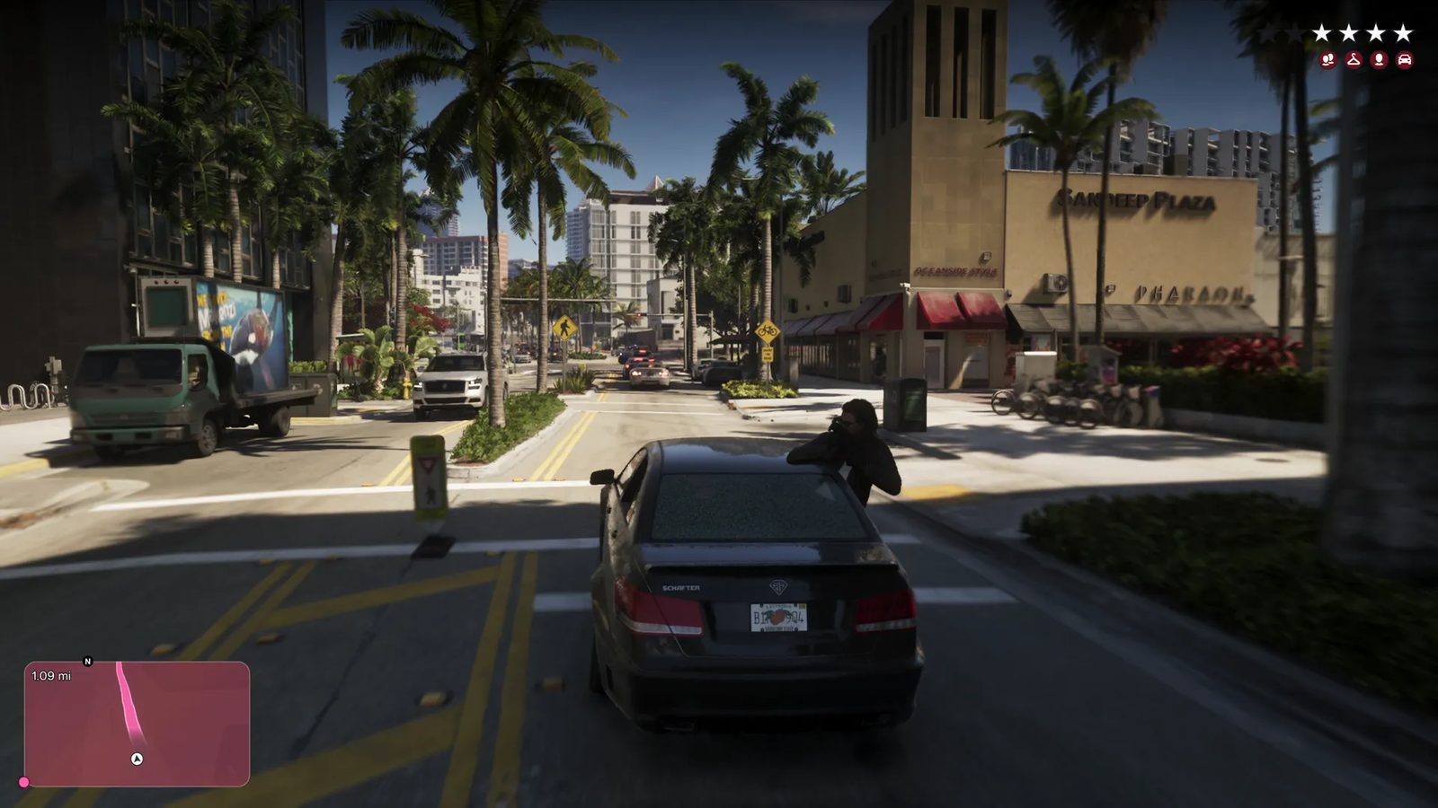 A person in dark clothes aims a weapon over the roof of a black Schafter saloon on a sunny, palm-lined street, with a four-star wanted level shown.