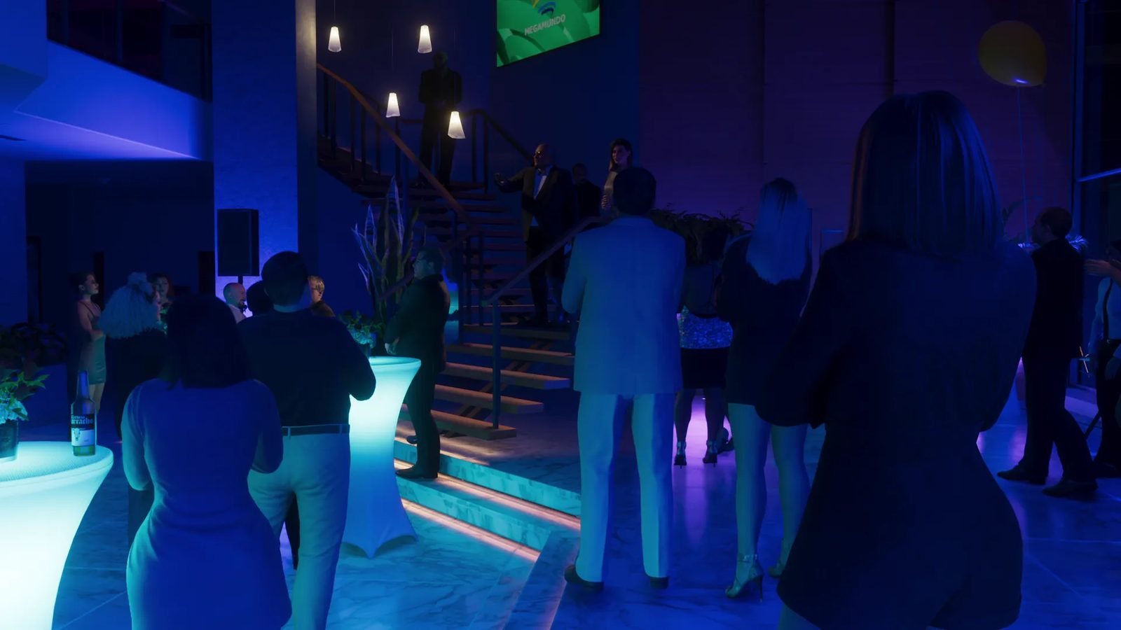 Guests gather at a party in a blue-lit atrium beneath a staircase, with a Megamundo logo on a green screen above, in the Megamundo Building.