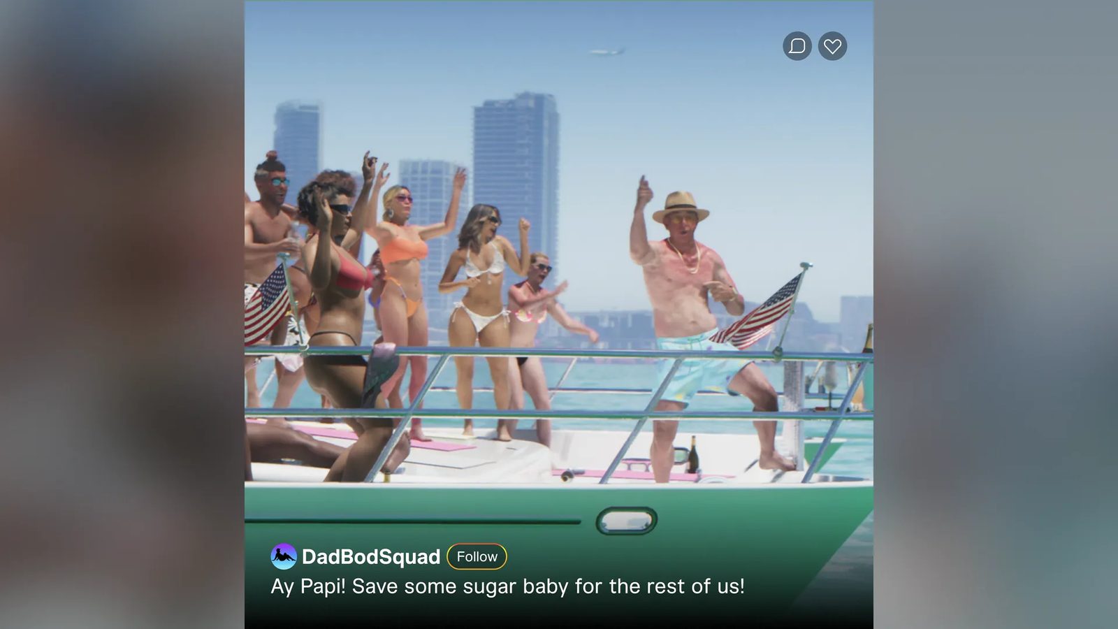 A man in a straw hat and turquoise shorts dances on a green and white yacht with a group of people in swimwear, with city towers behind.