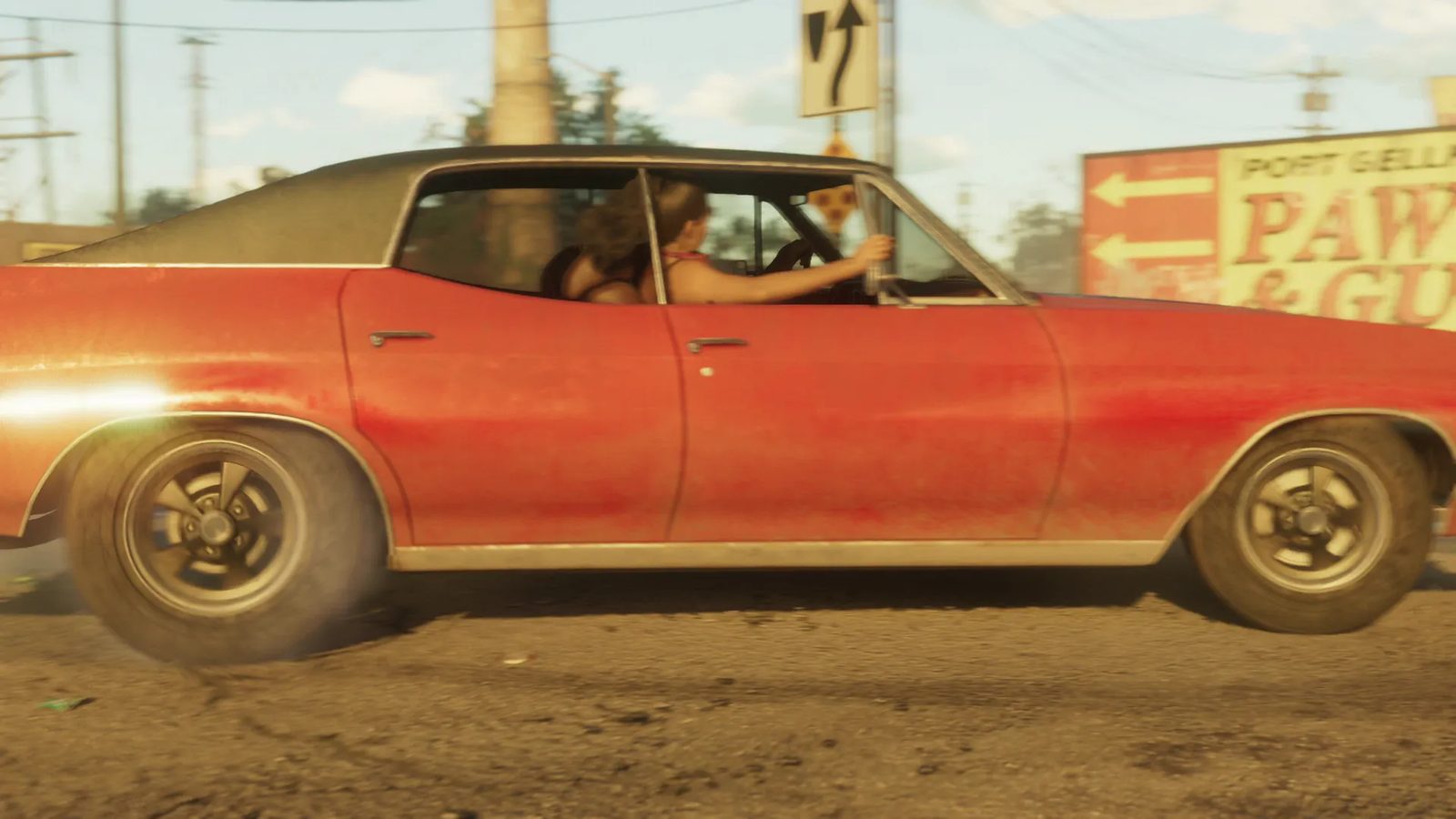A dusty red two-door car with a dark roof drives past a Port Gellhorn Pawn & Gun sign, a woman at the wheel, on a sunny street.
