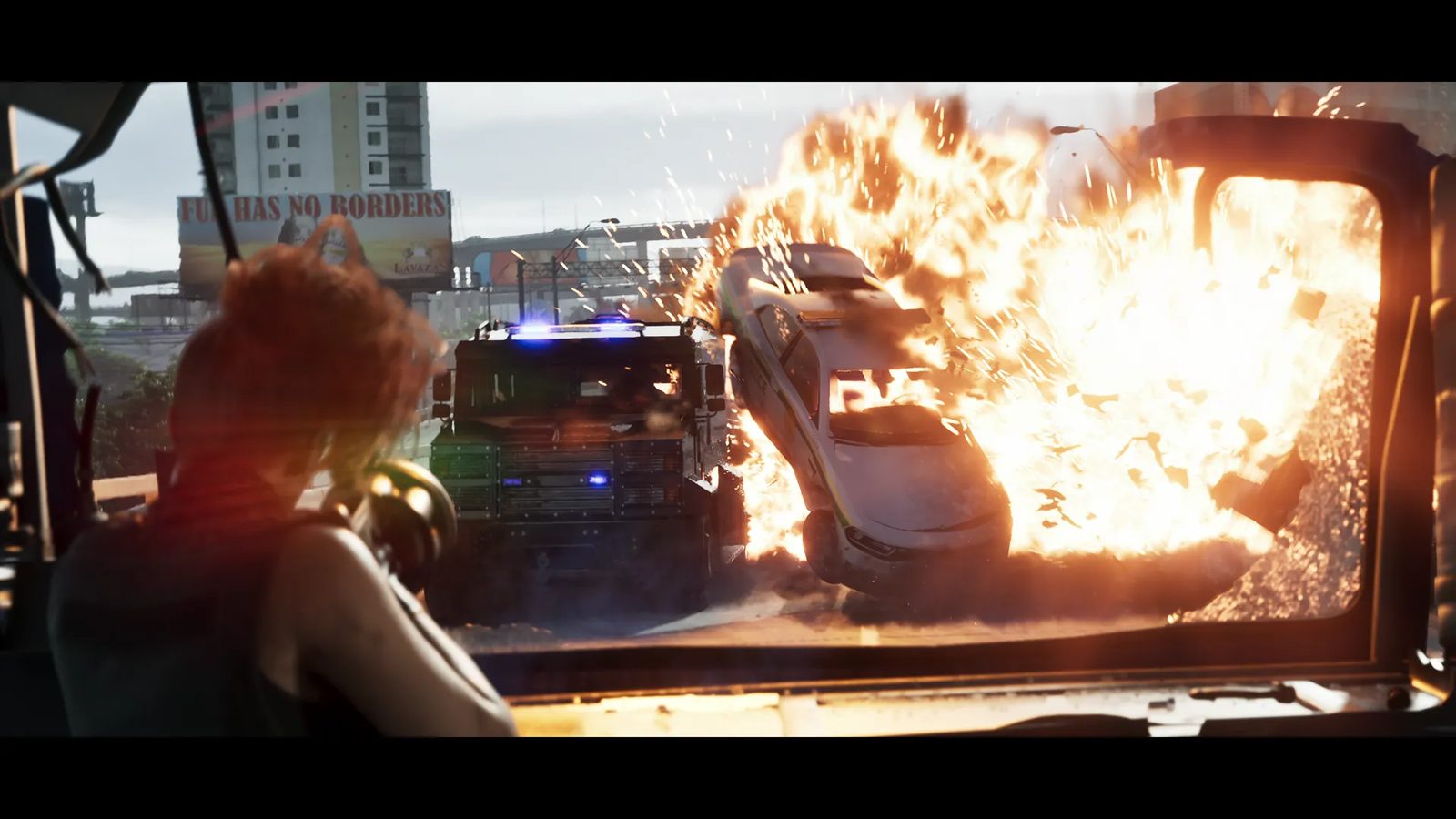 A woman with short red hair aims a launcher from inside a vehicle as a car is thrown up by an explosion beside a Brute Police Riot on a flyover.