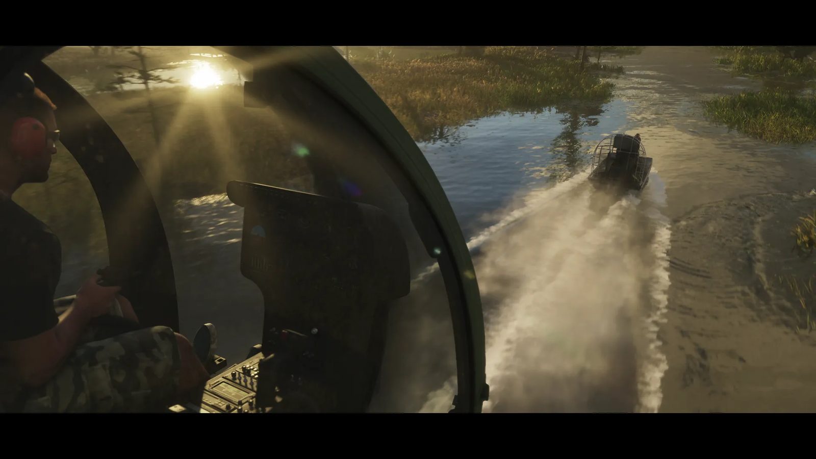 A man in a headset pilots a Nagasaki Buzzard Attack Chopper over Grassrivers, chasing an Airgator Airboat 09 across a marshy waterway at sunset.