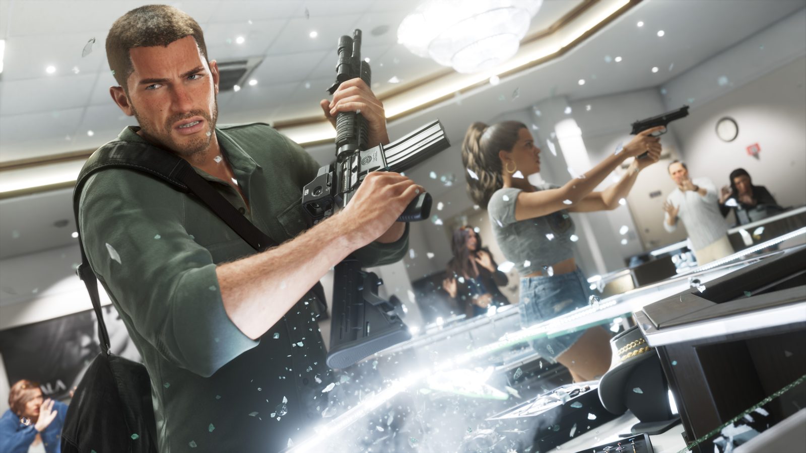 Jason Duval holds a rifle as Lucia Caminos aims a pistol in a jewellery shop while glass shatters and frightened customers cower.