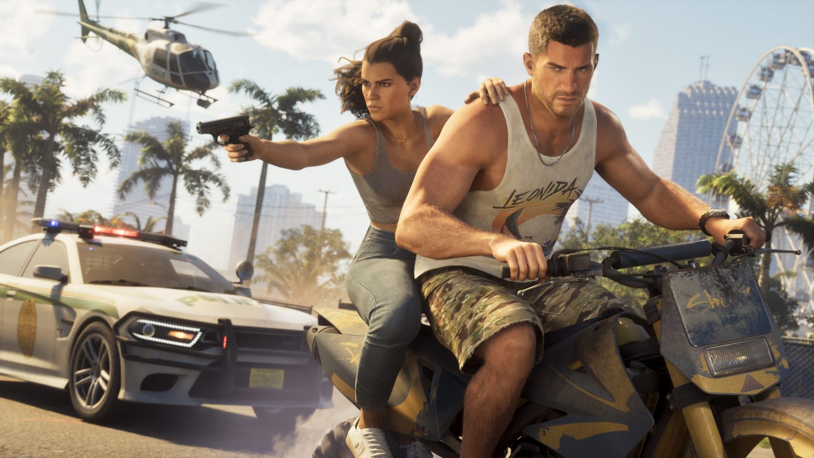 Jason Duval rides a dirty yellow motorbike while Lucia Caminos sits behind him aiming a pistol, with a police car and helicopter close by.