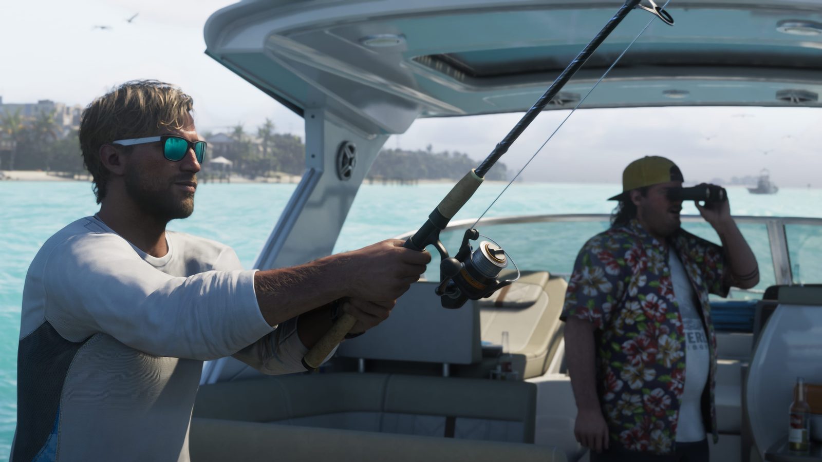 Jason Duval holds a bent fishing rod on a boat while a man in a floral shirt and yellow cap looks through binoculars, over turquoise water.