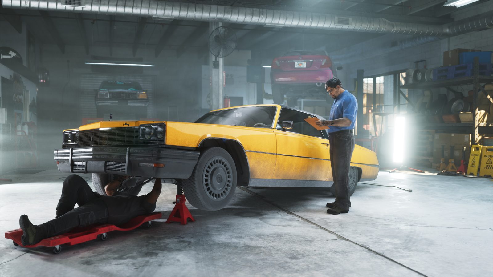 A mechanic lies under a yellow Albany Manana on a jack while a man in a blue shirt checks a clipboard in a busy garage workshop.