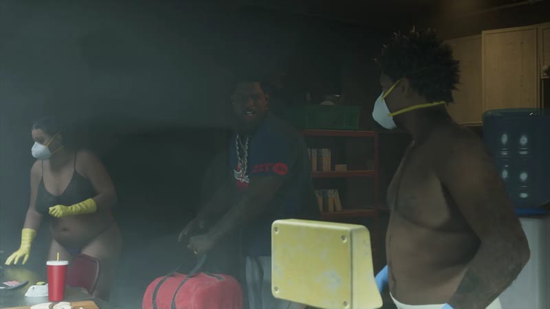 Three people in dust masks and rubber gloves work in a dim, smoky room, one man in a blue ZIT T-shirt gripping a red holdall.