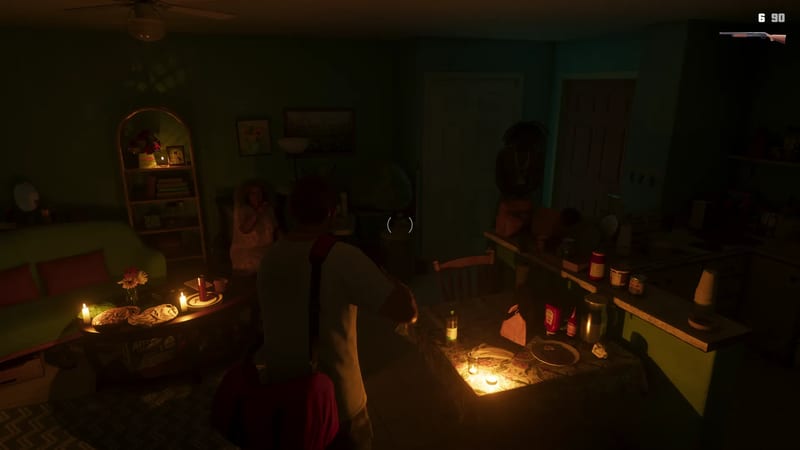 A man with a red strap over his shoulder stands in a dim, candlelit living room, facing a seated woman and a figure in the kitchen doorway.