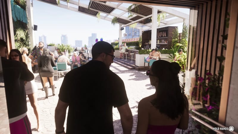 A man in a black shirt and sunglasses and a woman with dark hair walk onto a sunny rooftop bar, with the Effluvia sign and city skyline ahead.