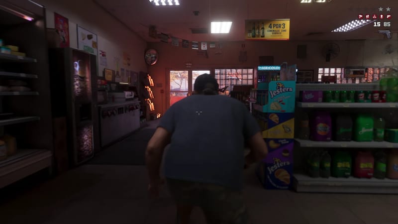 A heavyset man in a blue T-shirt and camouflage shorts walks through a dim convenience store towards an open door, past shelves of drinks and snacks.