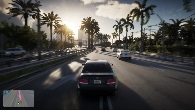 A dark grey Schafter saloon drives along a palm-lined road in Vice City towards a low sun, with white cars ahead and a sat-nav minimap in the corner.