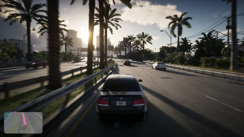 A dark grey Schafter saloon drives along a palm-lined road in Vice City at sunset, with tower blocks ahead and a minimap in the corner.