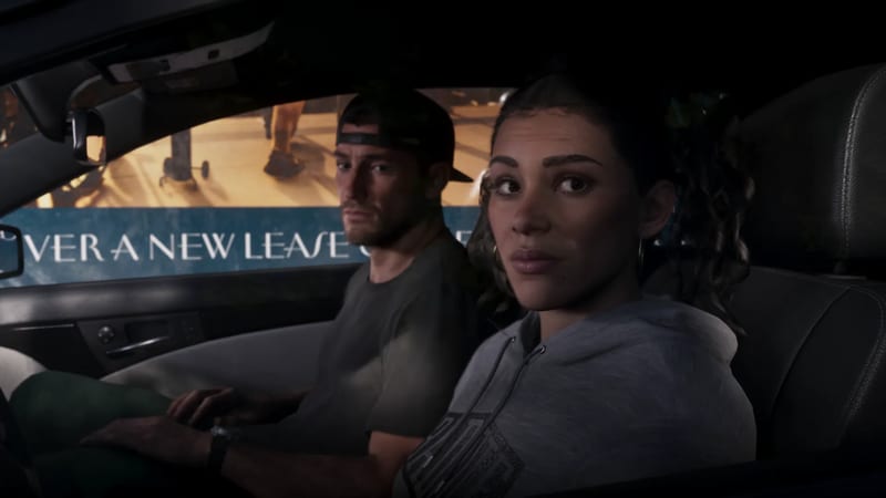 Jason Duval and Lucia Caminos sit in a car at night, looking towards the camera, with a lit billboard reading "A NEW LEASE" behind them.
