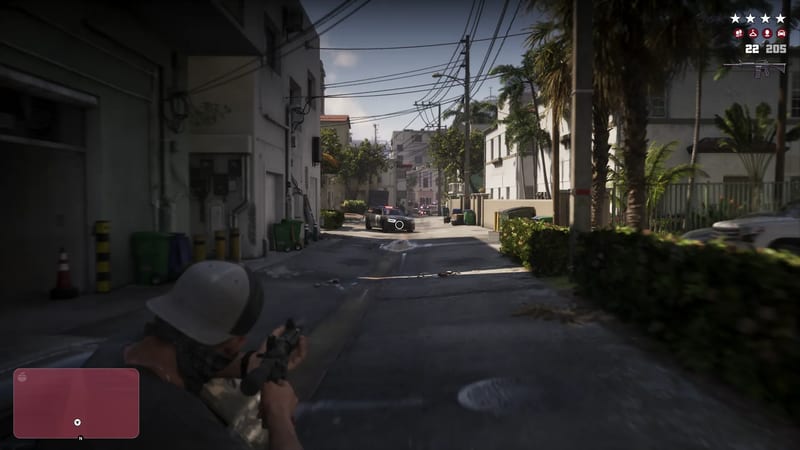 A man in a cap and face covering aims a rifle down a narrow Vice City back street at an approaching police car, with a four-star wanted level shown.