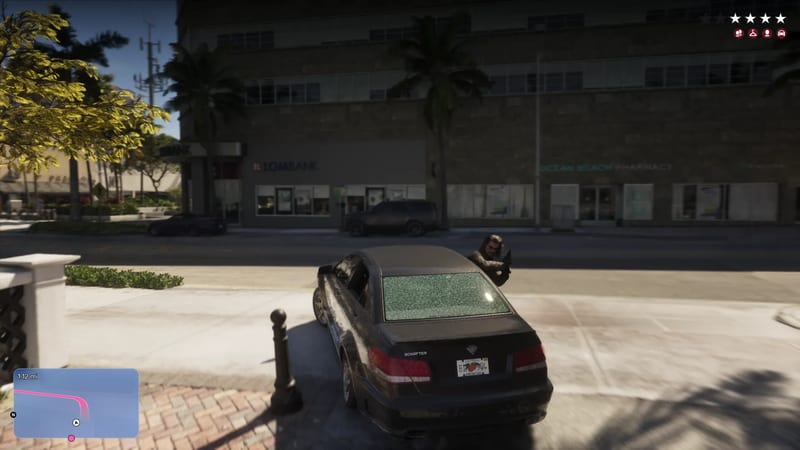 A man crouches behind a dark Schafter saloon with a smashed rear window on a sunny palm-lined street in Vice City, with a four-star wanted level.