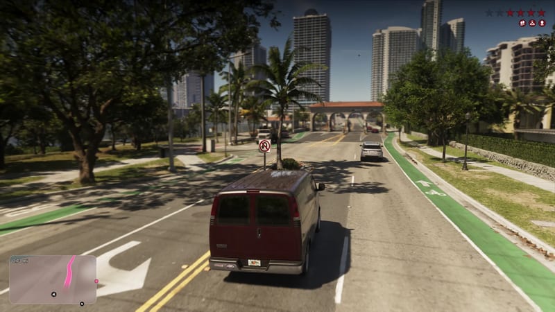A dark red van drives along a wide palm-lined street towards an arched gateway, with tall towers ahead and green cycle lanes either side in Vice City.