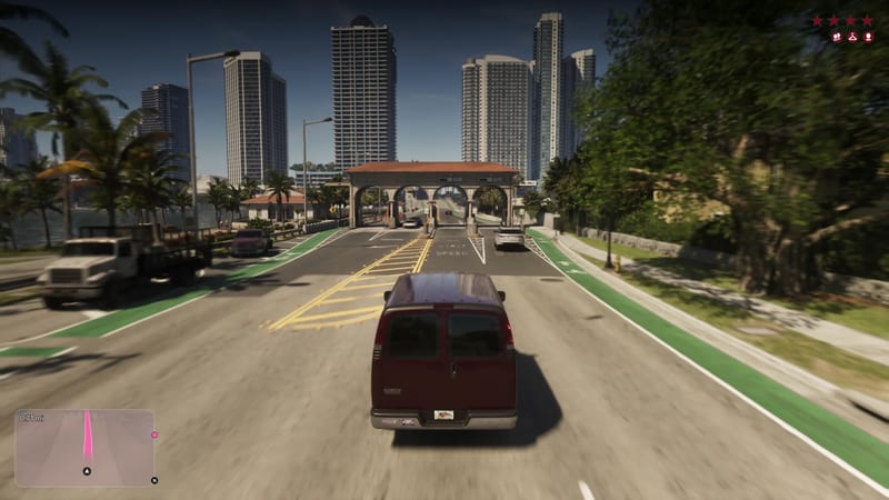 A dark red van drives towards a toll gate with arches on a Vice City road beside green bike lanes, with tall towers behind on a sunny day.