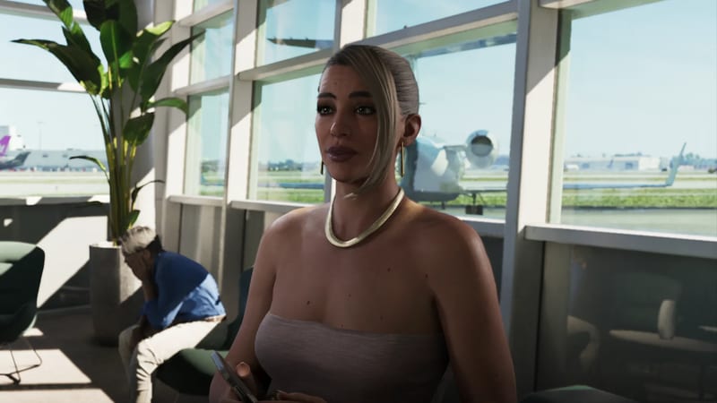 A blonde woman with a slicked-back ponytail holds a phone in an airport lounge, with a private jet visible through the tall windows behind her.