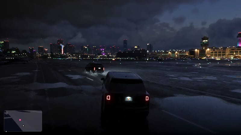 Two dark SUVs drive across a wet airport apron at night, with the Vice City International Airport control tower and a lit city skyline ahead.