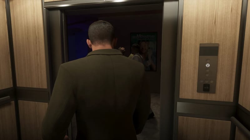 A man in a dark olive jacket, seen from behind, steps out of a wood-panelled lift towards a dim corridor where a few people stand.