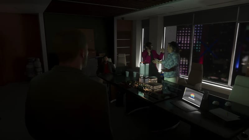 Two men talk animatedly beside a lit architectural model of a tower in a dark office, while a seated man and a man in the foreground watch.