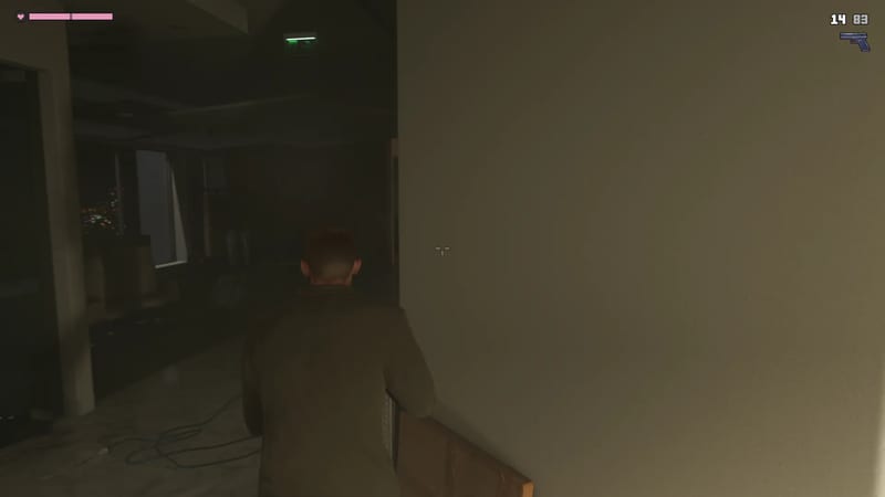 Jason Duval, seen from behind, creeps along a dark office corridor beside a wall, with city lights glowing through a window.