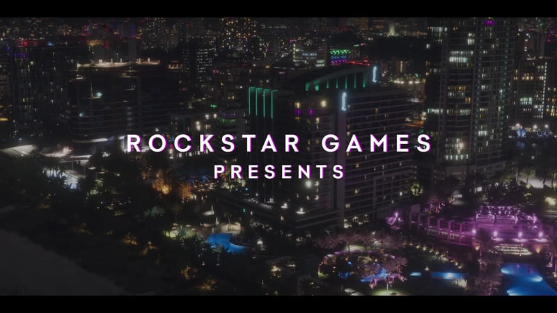 Rockstar Games Presents title text over an aerial view of Vice City's hotels and towers lit up at night, with palm trees and glowing pools below.