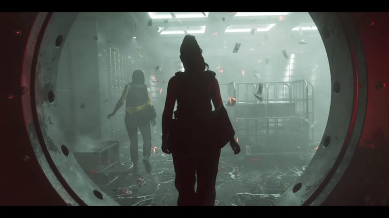Two women in silhouette walk into a smoky bank vault through a large round door, with banknotes and embers drifting through the air.