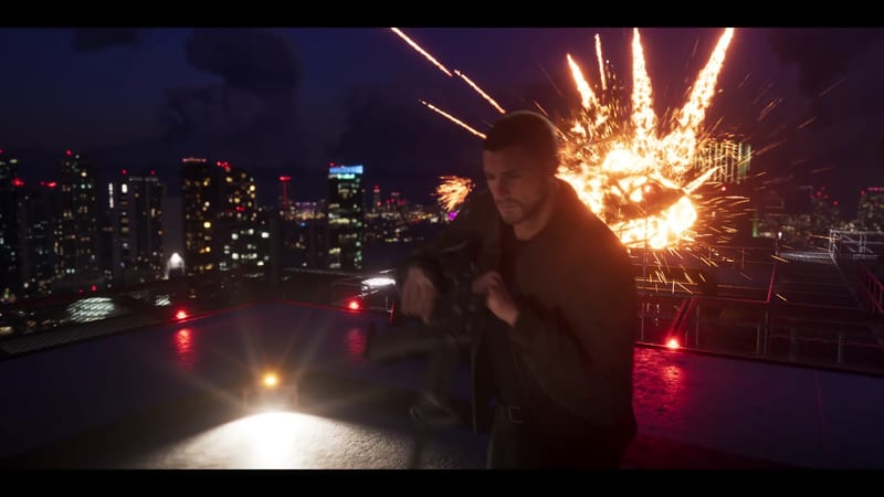 A man in a dark jacket holds a rifle on a rooftop helipad at night as a large fiery explosion bursts behind him, with a lit city skyline beyond.