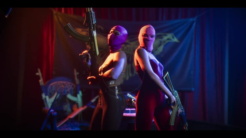 Two women in pink and purple balaclavas stand back to back holding golden assault rifles in front of red curtains and a large banner.