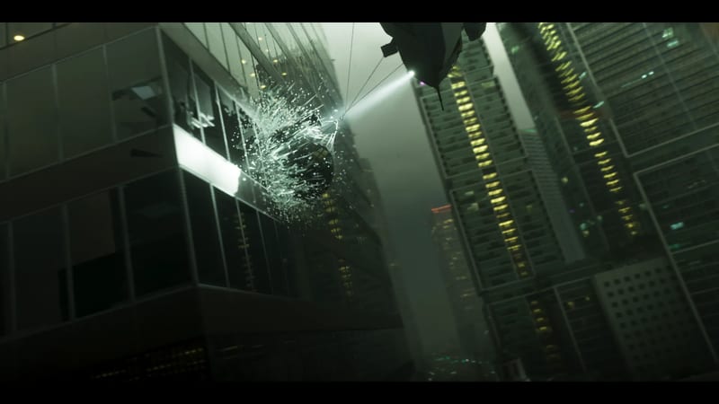 A dark object smashes through a glass skyscraper window, sending shards flying, as a spotlight beams from an aircraft above a foggy city of towers.