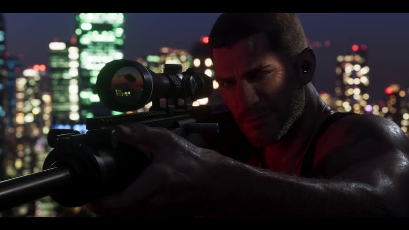 A muscular man with short hair and a stubbly beard aims a scoped sniper rifle at night, with a blurred, brightly lit city skyline behind him.