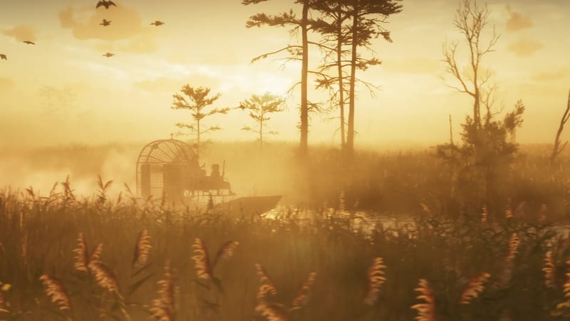 Two silhouetted people ride an airboat through misty reeds and tall pines in Grassrivers at golden sunrise or sunset, with birds flying overhead.