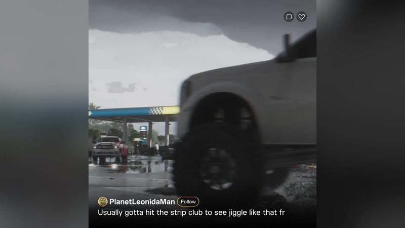 A large white pickup truck passes close to the camera at a petrol station under a dark storm cloud, with wet ground and a social media caption below.
