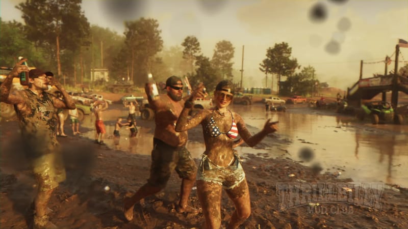 Three mud-covered people dance and hold bottles beside a muddy pool at Thrillbilly Mud Club, with trucks and other revellers behind them.