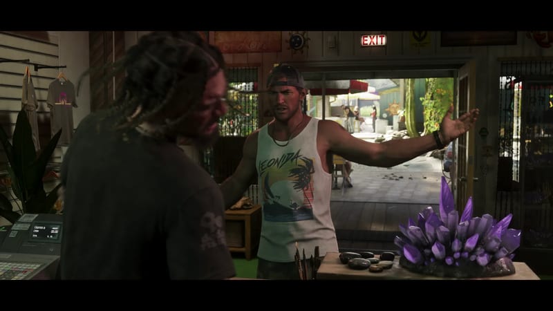 A man in a backwards cap and a Leonida vest holds his arms out in a shop, facing a man with dreadlocks, beside a purple crystal cluster.