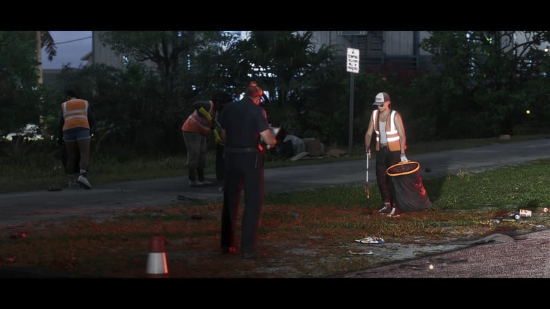 A police officer with a clipboard talks to roadside litter pickers in orange hi-vis vests on a grass verge at dusk.