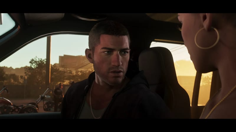 Jason Duval sits in a car at golden hour, looking at a woman in hoop earrings, with motorcycles and a man outside the window.