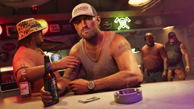 Jason Duval, in a cap and grey vest, leans on a bar holding a beer bottle while a man in a bucket hat touches his arm and two men watch behind.