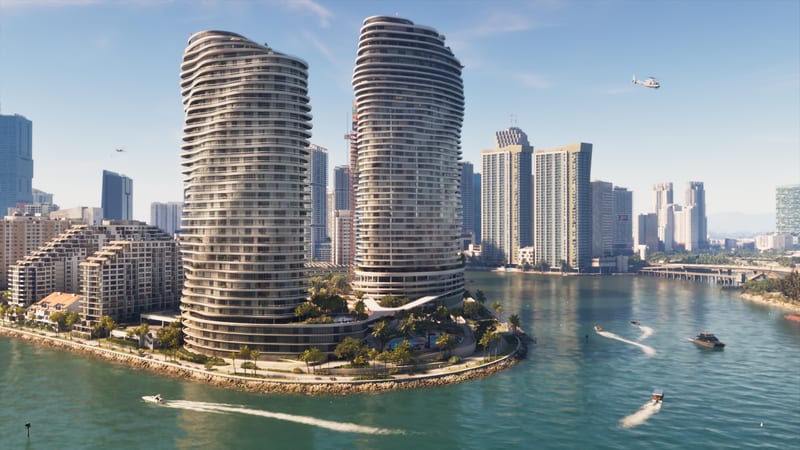 Two curved white high-rise towers stand on a palm-lined waterfront point in Vice City, with speedboats and a helicopter over a bay on a sunny day.