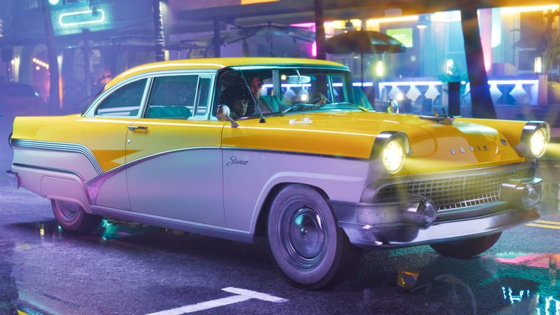 A yellow and white '55 Vapid Stanier with its headlights on drives down a wet, neon-lit street at night, with two people inside.